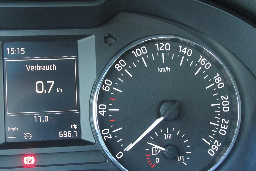 Laptop displaying a speed gauge and website performance metrics, relating to choosing a CDN for WordPress